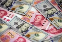 Chinese Yuan Weakens to 7.0982 Against Dollar