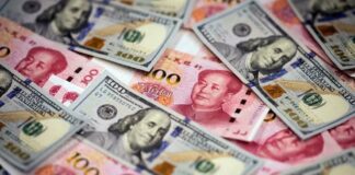 Chinese Yuan Weakens to 7.0982 Against Dollar